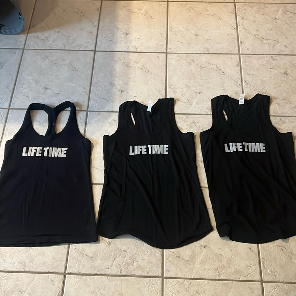 Set of three Lifetime fitness instructor tank tops in black and gray sz small